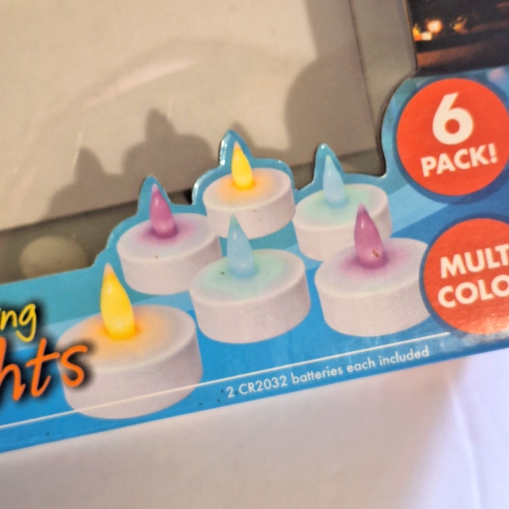 Banana Boat 6 Pack Floating LED Flickering Tea Light Candles Multicolor NIB